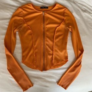 LONG SLEEVE FULL ZIP ASYMMETRICAL TOP